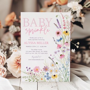 May include: A baby sprinkle invitation with the words "BABY sprinkle" in pink script. The invitation includes details for Alyssa Miller's baby sprinkle, with a floral border of colorful wildflowers. The event is on March 12th.