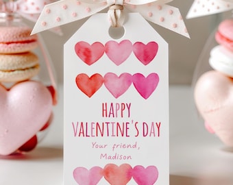 May include: A white gift tag with a pink and red watercolor heart design. The tag says "Happy Valentine's Day" and "Your friend, Madison".