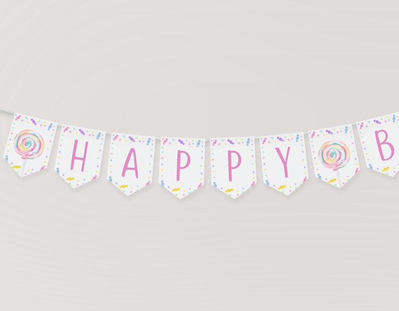 May include: A white banner with pink letters spelling "HAPPY" and a "B" at the end. The banner is decorated with colorful candy and lollipop designs.