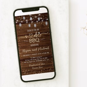 May include: A digital invitation for a wedding BBQ, featuring a rustic wood background with string lights and gold glitter. The invitation reads "Join us for an I do BBQ honoring Alyssa and Michael, Saturday, August 15th, 8:00 PM, The Miller's backyard, 125 West 8th Street, New York, NY 10020, RSVP by August 5th, 97628.2455 call or text, Registered at Store Names Here."
