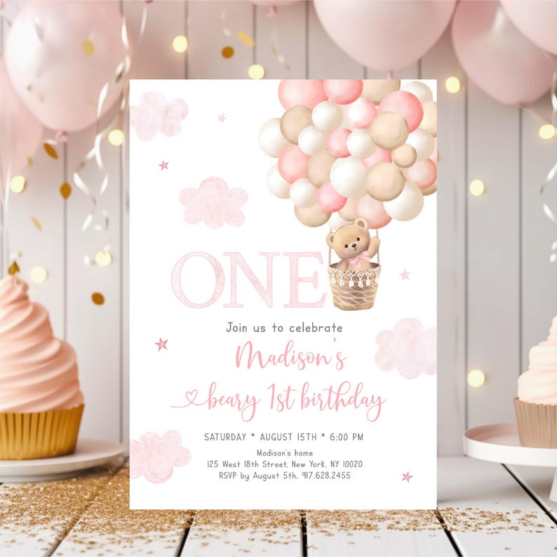 May include: Pink and beige birthday invitation with a teddy bear in a hot air balloon made of pink and beige balloons. The invitation says "ONE" and "Join us to celebrate Madison's beary 1st birthday".