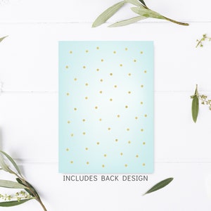 May include: A light blue card with a gold polka dot pattern. The text "INCLUDES BACK DESIGN" is printed at the bottom of the card.