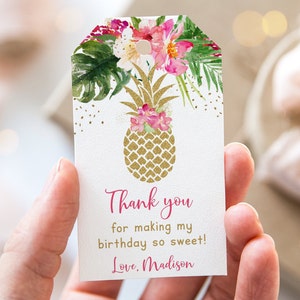May include: A white thank you tag with a gold pineapple and pink flowers. The text reads "Thank you for making my birthday so sweet! Love, Madison".
