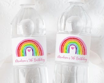 May include: Two clear plastic water bottles with rainbow and heart labels. The labels say "Madison's 5th Birthday".