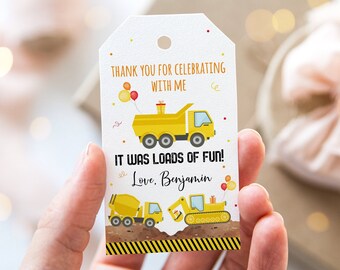 May include: A yellow thank you tag with a construction truck, a cement mixer, and an excavator. The tag says "Thank you for celebrating with me. It was loads of fun! Love, Benjamin."
