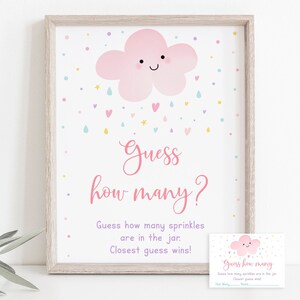 May include: A pink cloud with a smiling face and a heart, surrounded by colorful sprinkles, with the text "Guess how many?" and "Guess how many sprinkles are in the jar. Closest guess wins!"