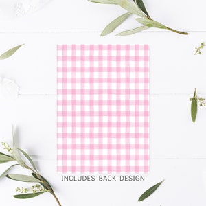 May include: Pink and white gingham pattern on a white background. The text "INCLUDES BACK DESIGN" is printed below the pattern.