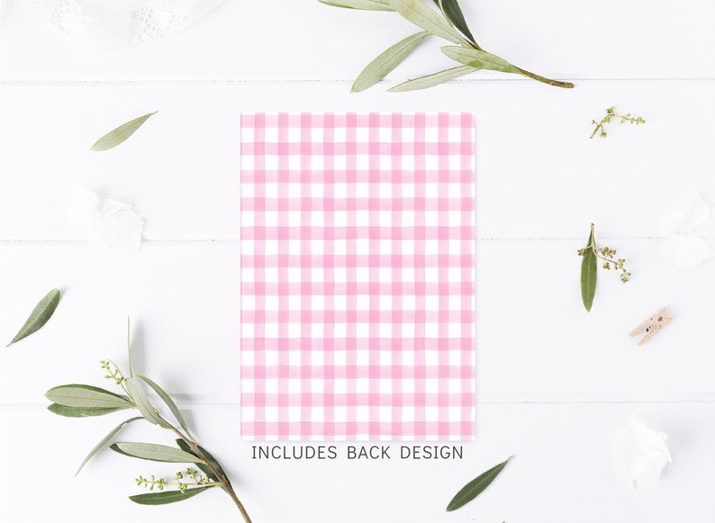 May include: Pink and white gingham pattern on a white background. The text "INCLUDES BACK DESIGN" is printed below the pattern.