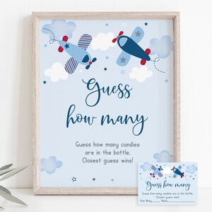 May include: Blue and red airplane themed printable game card with the text "Guess how many" and instructions to guess how many candies are in a bottle. The closest guess wins.