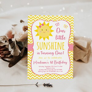 May include: A yellow and pink first birthday invitation with a smiling sun and butterflies. The text reads "Our little SUNSHINE is turning One!" and includes details for the party, including the date, time, location, and RSVP information.