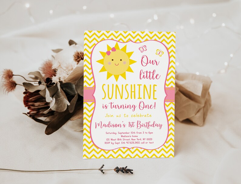 May include: A yellow and pink first birthday invitation with a smiling sun and butterflies. The text reads "Our little SUNSHINE is turning One!" and includes details for the party, including the date, time, location, and RSVP information.