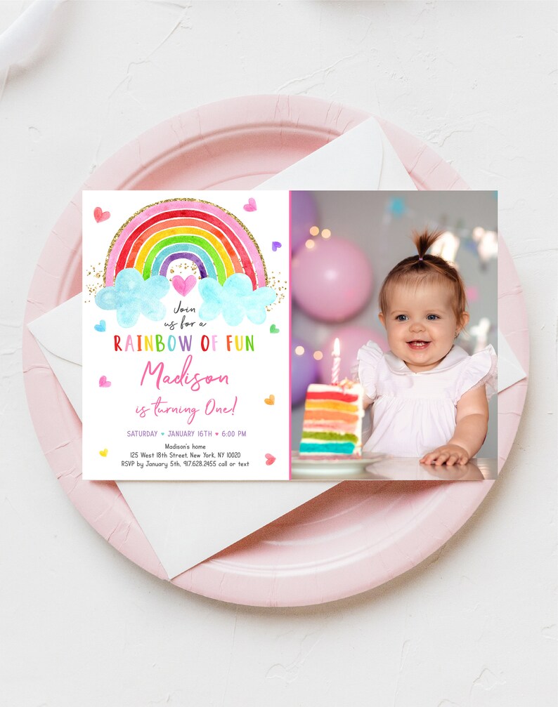 May include: A rainbow-themed first birthday party invitation with a photo of a baby girl. The invitation features a rainbow with clouds, hearts, and glitter. The text reads "Join us for a Rainbow of Fun Madison is turning One!" with the date, time, and location of the party.