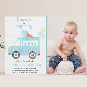 May include: A blue and white ice cream truck with ice cream cones and popsicles on top. The truck is on a light blue background with yellow and white sprinkles. The text "Benjamin is a SWEET ONE" is at the top of the card. The text "Join us to celebrate BENJAMIN'S FIRST BIRTHDAY" is below the truck. The text "Saturday, August 15th at 3:00 PM 125 West 18th Street, New York, NY 10020 RSVP to by August 1st. 917-628-2455" is at the bottom of the card.