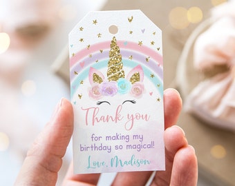 May include: A white thank you tag with a unicorn illustration. The unicorn has a rainbow mane and tail, glitter horn, and floral headband. The tag says "Thank you for making my birthday so magical! Love, Madison".