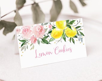 May include: A white card with pink flowers and yellow lemons on a branch. The card has gold glitter dots and the text "Lemon Cookies" in pink.