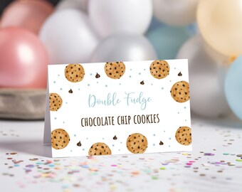 May include: White card with blue and brown watercolor cookie illustrations. The text on the card reads "Double Fudge Chocolate Chip Cookies".