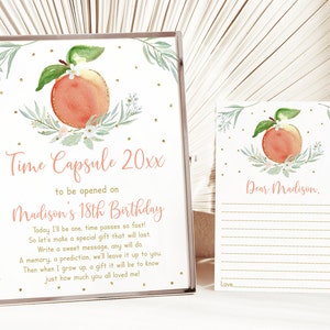 May include: A peach-themed time capsule card with gold glitter and a peach illustration. The card says "Time Capsule 20xx to be opened on Madison's 18th Birthday". A separate card says "Dear Madison." with lines for writing.