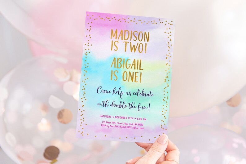 May include: A colorful invitation with gold glitter accents. The text reads "Madison is Two! Abigail is One! Come help us celebrate with double the fun! Saturday November 15th 6:00 PM 125 West 8th Street New York, NY 10003 RSVP by Nov 5th 97628265 call or text"