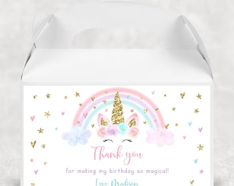 May include: White favor box with a unicorn and rainbow design. The box has a handle and says "Thank you for making my birthday so magical! Love, Madison".