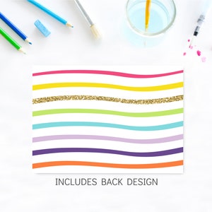 May include: A colorful printable design with wavy lines in pink, yellow, green, blue, purple, and orange. A gold glitter line is included in the design. The text "INCLUDES BACK DESIGN" is at the bottom of the design.