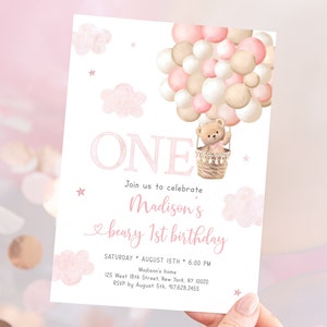 May include: Pink and beige watercolor invitation with a teddy bear in a hot air balloon made of balloons. The invitation says "ONE" and "Join us to celebrate Madison's beary 1st birthday".