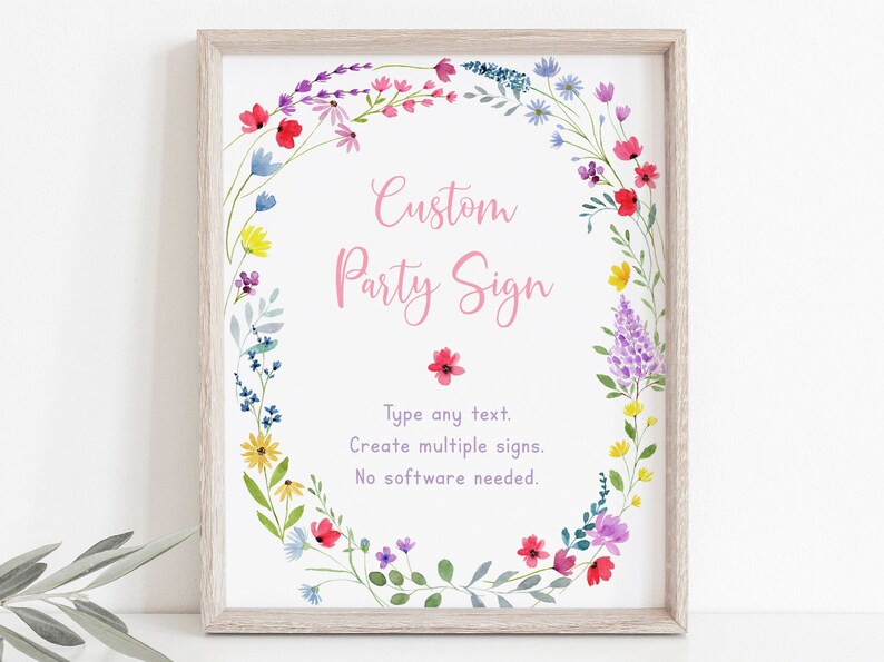 May include: A printable sign with a floral wreath border. The text reads "Custom Party Sign" in pink lettering. The text below reads "Type any text. Create multiple signs. No software needed."