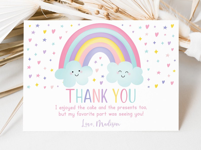 May include: A thank you card with a rainbow and clouds. The card has the text "THANK YOU" and "I enjoyed the cake and the presents too, but my favorite part was seeing you! Love. Madison."