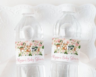 May include: Two clear plastic water bottles with personalized labels. The labels feature a floral design with pink flowers, green leaves, and woodland animals. The text on the labels reads "Alyssa's Baby Shower".