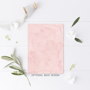 May include: A pink watercolor background with a subtle marbled effect. This design is ideal for a wedding invitation or other special occasion.