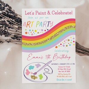 May include: A colorful invitation for an art party celebrating a 5th birthday. The invitation features a rainbow with gold glitter, paint splatters, and a paint palette with a paintbrush. The text on the invitation reads "Let's Paint & Celebrate!" and "Join us for an ART PARTY".