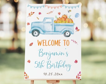 May include: A welcome sign for a 5th birthday party featuring a blue pickup truck carrying pumpkins and a balloon. The sign says "Welcome to Benjamin's 5th Birthday" and the date "10.25.20xx".