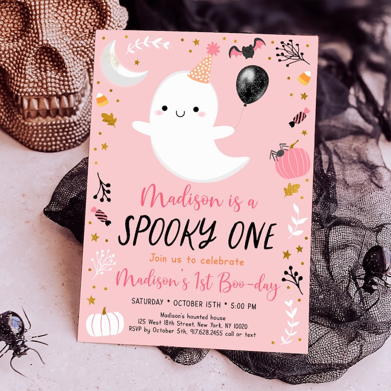 May include: Pink and gold Halloween party invitation featuring a cute ghost wearing a party hat and holding a black balloon. The text reads "Madison is a Spooky One. Join us to celebrate Madison's 1st Boo-day. Saturday, October 15th, 5:00 PM. Madison's haunted house, 125 West 18th Street, New York, NY 10020. RSVP by October 5th, 917.628.2455 call or text."