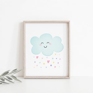 Puede incluir: Una impresi&oacute;n enmarcada de una nube de dibujos animados azul claro con una cara sonriente y mejillas rosadas. La nube est&aacute; lloviendo corazones y estrellas de colores.