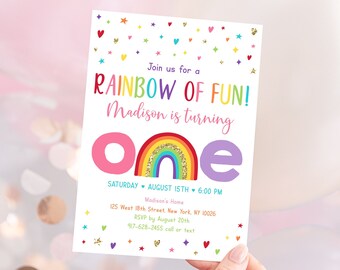 May include: Rainbow-themed first birthday party invitation with a colorful rainbow and the words "Rainbow of Fun!" and "Madison is turning one". The invitation includes the date, time, and location of the party.