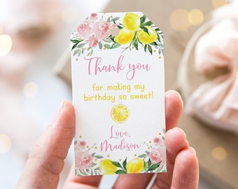 May include: A white thank you tag with pink and yellow floral designs. The tag says "Thank you for making my birthday so sweet! Love, Madison".
