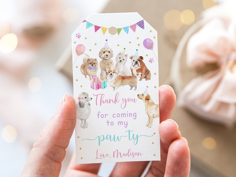 May include: Thank you for coming to my paw-ty. Love, Madison. A white card with a pink, purple, and blue paw-ty theme with a watercolor illustration of dogs wearing party hats.