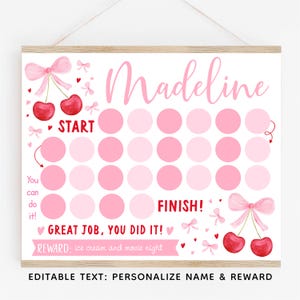 Puede incluir: Un cuadro de recompensas rosa y blanco con el nombre "Madeline" en la parte superior. El cuadro presenta círculos rosas, cerezas, lazos y las frases "Start" y "Finish". La parte inferior dice "Great job, you did it!" y "Reward: ice cream and movie night."
