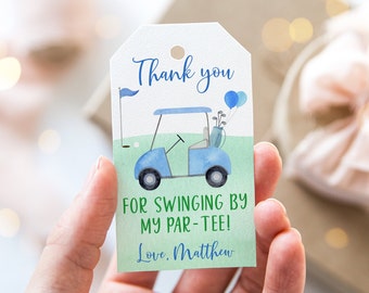 May include: A blue and white golf cart with golf clubs and balloons on top. The tag says "Thank you for swinging by my par-tee! Love, Matthew".