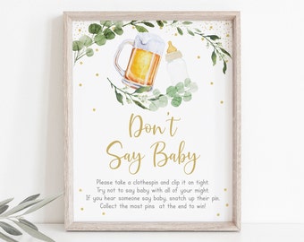 May include: A printable sign for a baby shower game called "Don't Say Baby". The sign has a gold background with green leaves and gold polka dots. It features a beer mug and a baby bottle.