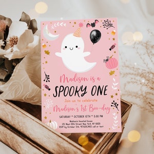 May include: Pink and white Halloween party invitation featuring a cute ghost wearing a party hat and holding a black balloon. The text reads "Madison is a Spooky One" and "Join us to celebrate Madison's 1st Boo-day".