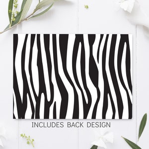 K&ouml;nnte beinhalten: Schwarz-wei&szlig;es Zebra-Muster. Enth&auml;lt das Design der R&uuml;ckseite.