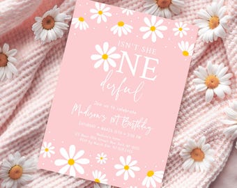 May include: Pink birthday invitation with white daisies and the text "Isn't she one derful" and "Madison's 1st Birthday".