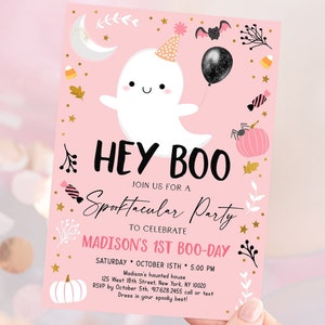 May include: Pink and gold Halloween party invitation with a cute ghost illustration, the text "Hey Boo", and the words "Spooktacular Party" in cursive. The invitation includes details for a first birthday party, including the date, time, and location.
