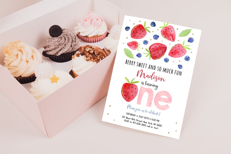 May include: A pink and white birthday invitation with a watercolor illustration of strawberries and blueberries. The text reads "Berry Sweet and So Much Fun Madison is turning one. Please join us to celebrate! Saturday, July 16th, 6:00 PM, 125 West 8th Street, New York, NY 10020, RSVP to 917-628-2465 call or text."