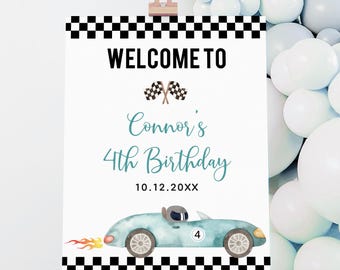 May include: A welcome sign for a fourth birthday party. The sign features the text "WELCOME TO" above "Connor's 4th Birthday" and the date. A light blue race car with flames is at the bottom. The sign has a black and white checkered border.