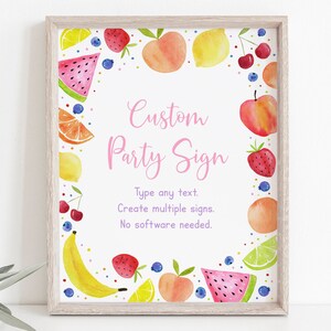 Op de afbeelding: Een printbaar partybord met een witte achtergrond en een roze rand. Het bord is versierd met een aquarel-illustratie van fruit, waaronder watermeloen, citroenen, perziken, kersen, aardbeien, bananen en limoenen. De tekst op het bord luidt "Custom Party Sign" en "Type any text. Create multiple signs. No software needed."