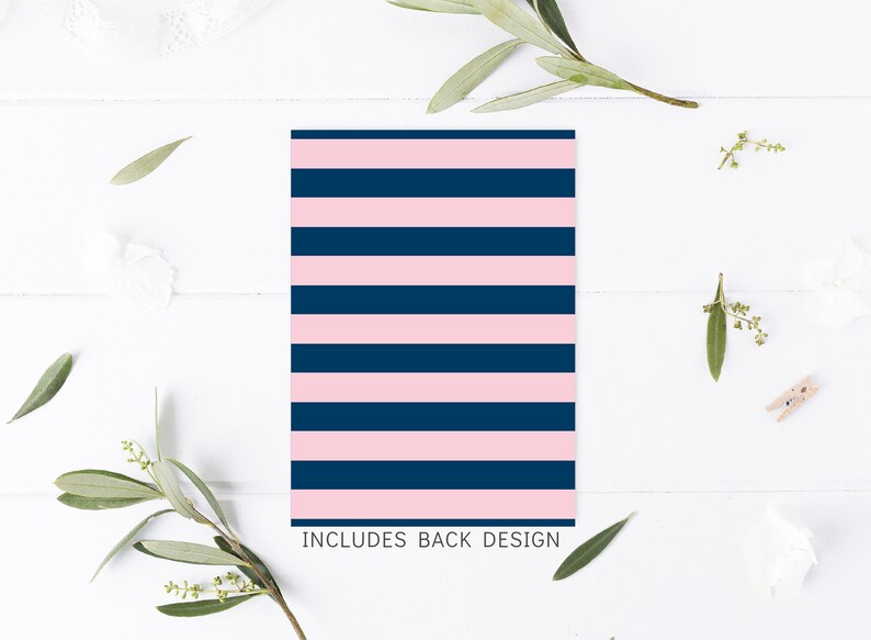 May include: A pink and navy blue striped card with the text "INCLUDES BACK DESIGN" at the bottom.