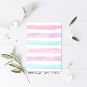 May include: A white card with a watercolour striped design in pink, purple, and blue. The text "OPTIONAL BACK DESIGN" is printed at the bottom of the card.