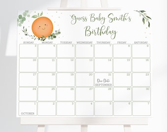 May include: A white calendar with green leaves and a smiling orange on the top. The calendar is for September and October and says "Guess Baby Smith's Birthday".