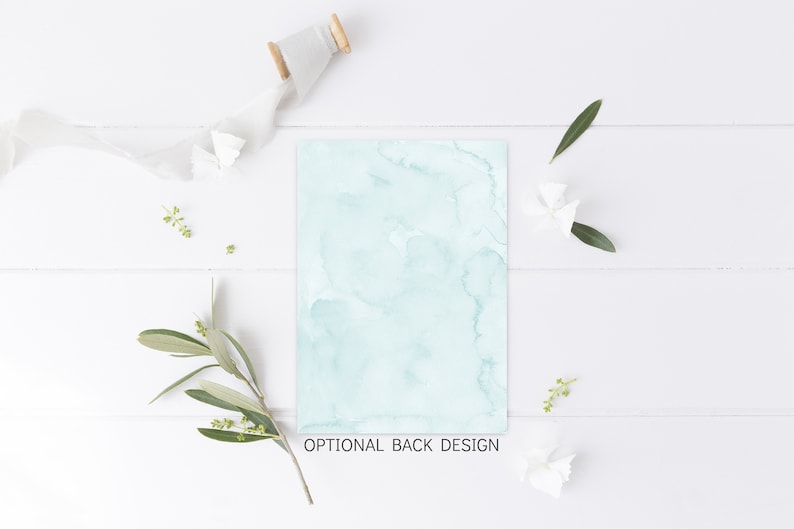 May include: A light blue watercolor background with a white wooden surface and green leaves and white flowers. The text "OPTIONAL BACK DESIGN" is at the bottom of the image.
